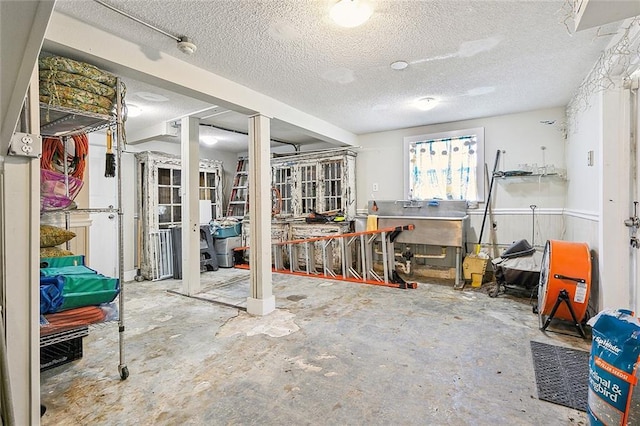 basement featuring a textured ceiling