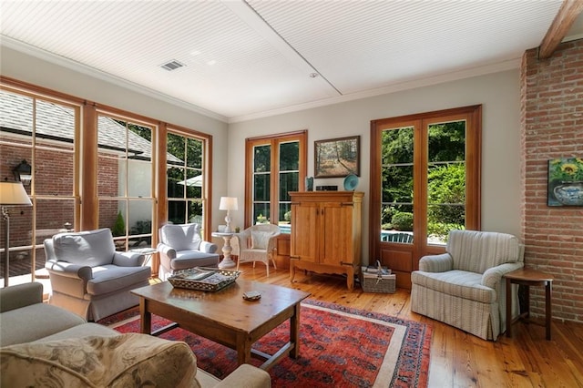 sunroom featuring a healthy amount of sunlight and french doors