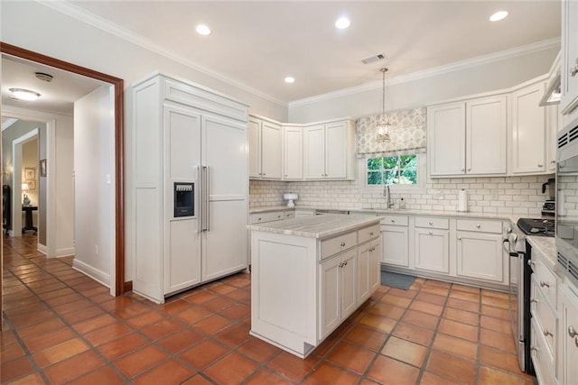 kitchen featuring tasteful backsplash, paneled built in refrigerator, stainless steel stove, white cabinetry, and hanging light fixtures