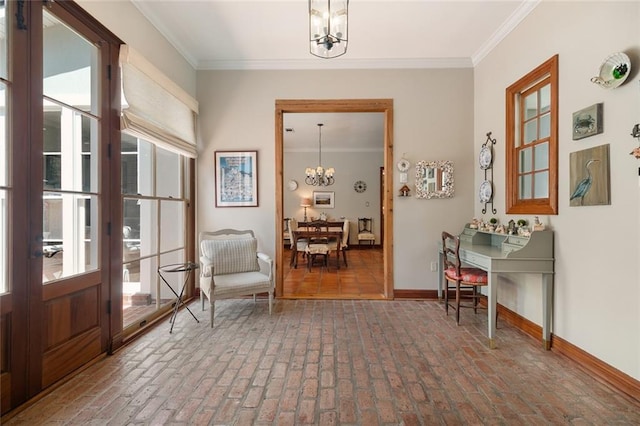 living area featuring a chandelier and ornamental molding