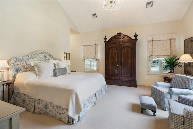 bedroom featuring light carpet, a chandelier, and vaulted ceiling