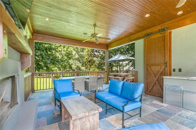 view of patio featuring an outdoor hangout area and ceiling fan