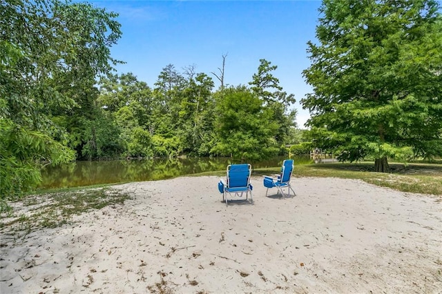 surrounding community featuring a water view