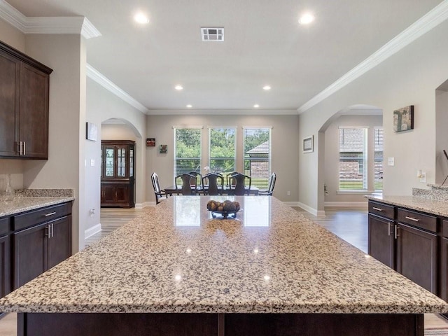 kitchen with light stone counters and a center island