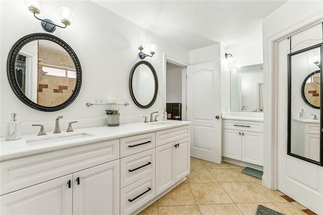 bathroom featuring tile patterned flooring and vanity