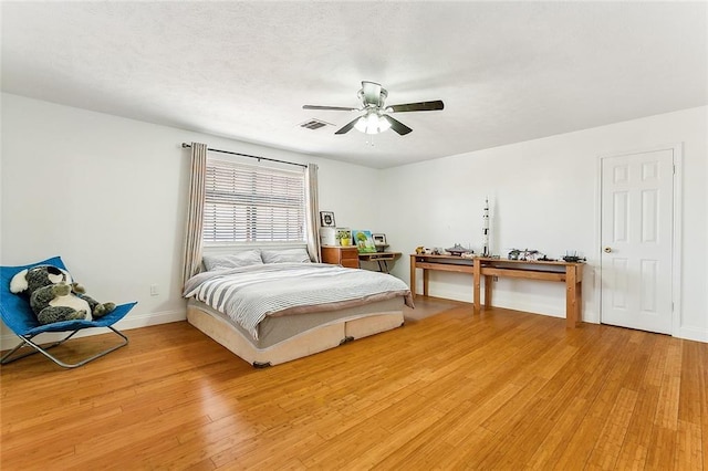 bedroom featuring light wood-type flooring and ceiling fan