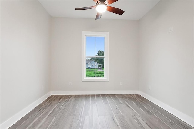 unfurnished room featuring ceiling fan and light hardwood / wood-style flooring