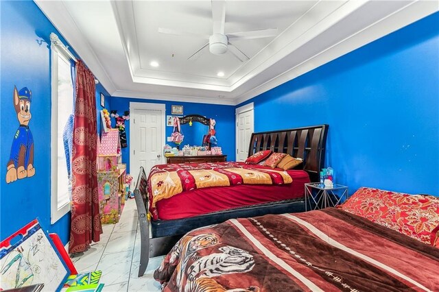 bedroom featuring ceiling fan, a raised ceiling, and crown molding