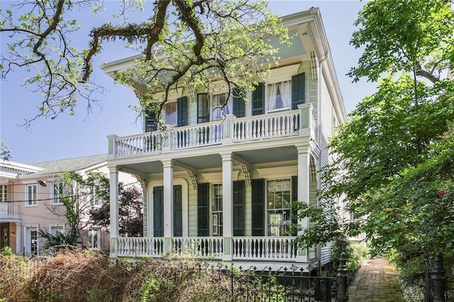 view of front of property with a balcony