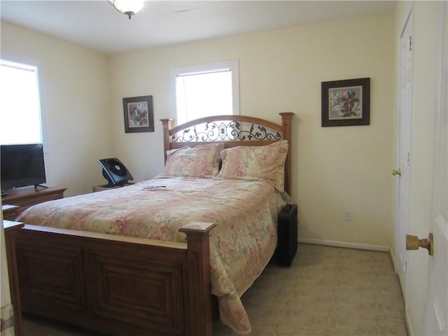 8719 Fig St, New Orleans, LA 70118 - bedroom with baseboards and light colored carpet