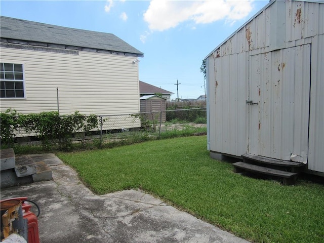 8719 Fig St, New Orleans, LA 70118 - view of yard featuring an outdoor structure and fence