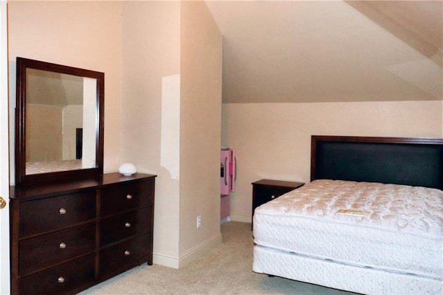 carpeted bedroom with vaulted ceiling