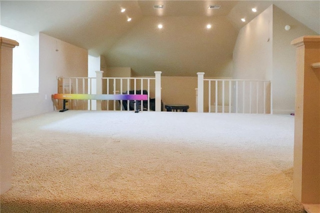 bonus room with carpet and vaulted ceiling