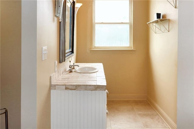 bathroom featuring vanity and tile patterned flooring