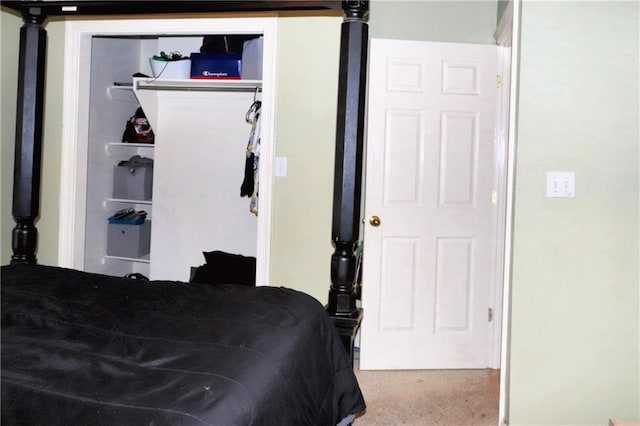 bedroom with a closet and carpet flooring