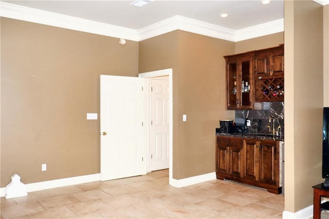 bar featuring light tile patterned flooring, tasteful backsplash, and ornamental molding