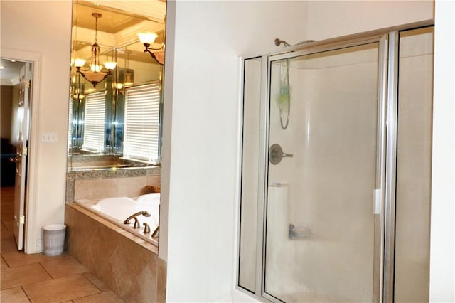 bathroom featuring shower with separate bathtub, tile patterned flooring, and a notable chandelier