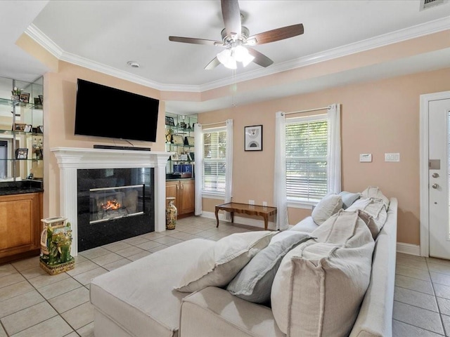 living room featuring light tile patterned floors, ceiling fan, and ornamental molding