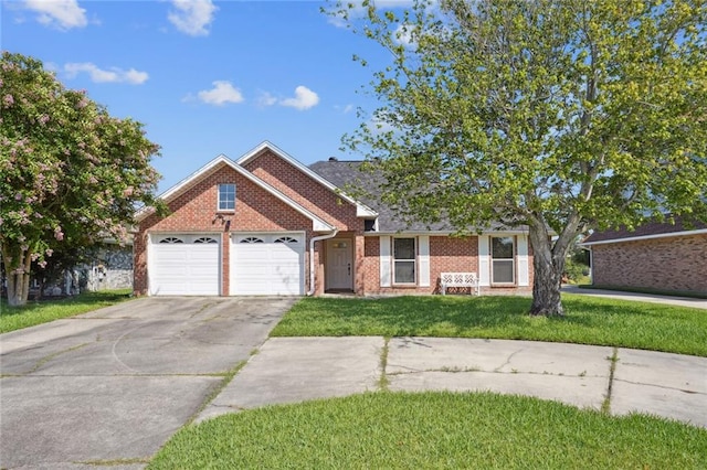 view of front facade with a garage and a front yard