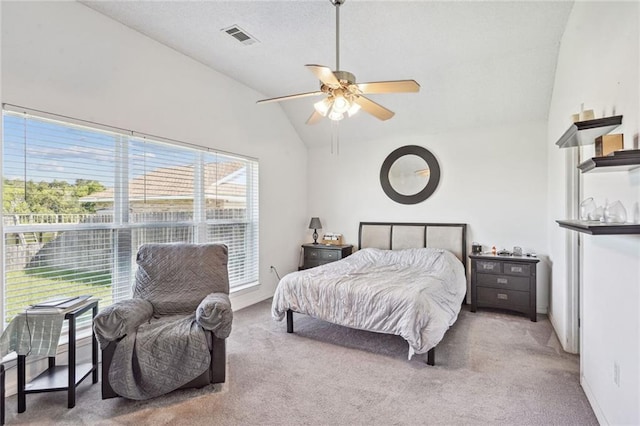 carpeted bedroom with lofted ceiling and ceiling fan