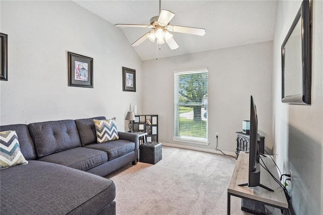 living room with light colored carpet, vaulted ceiling, and ceiling fan