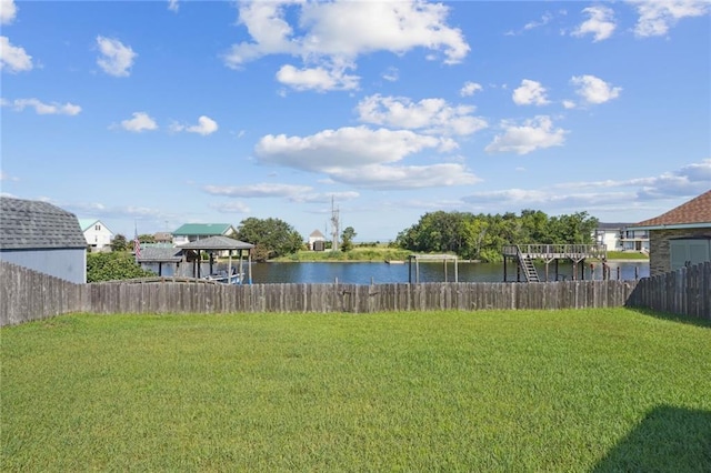 view of yard with a gazebo and a water view