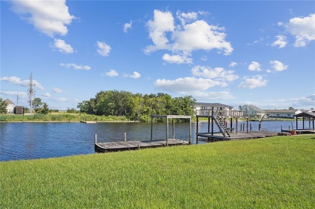 dock area with a water view and a lawn