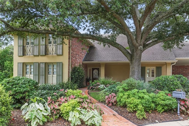 view of front of home with a balcony