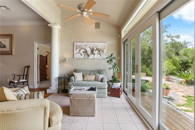 sunroom featuring decorative columns, vaulted ceiling, french doors, and ceiling fan