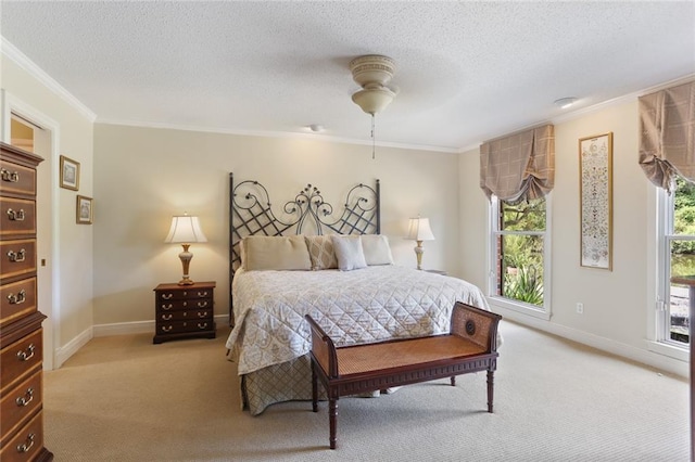 bedroom with crown molding, light colored carpet, a textured ceiling, and ceiling fan