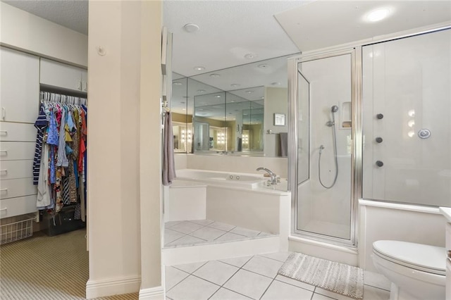 bathroom featuring separate shower and tub, toilet, and tile patterned floors