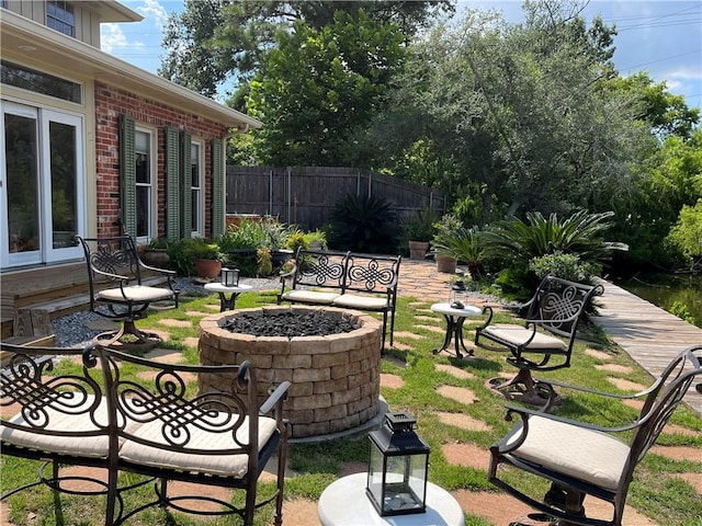 view of patio with an outdoor fire pit