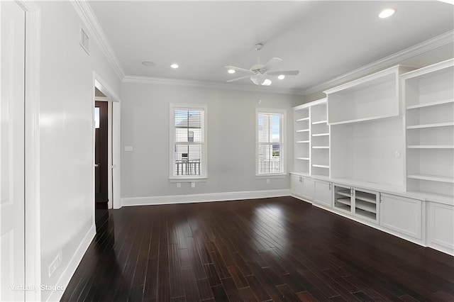 spare room with crown molding, dark hardwood / wood-style floors, and ceiling fan