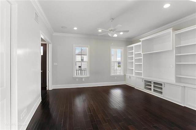 interior space featuring baseboards, ornamental molding, a ceiling fan, and dark wood-style floors