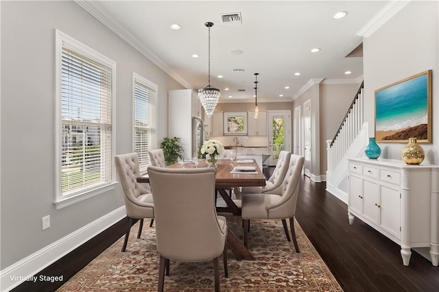 dining space with crown molding, dark wood-style flooring, baseboards, and stairway