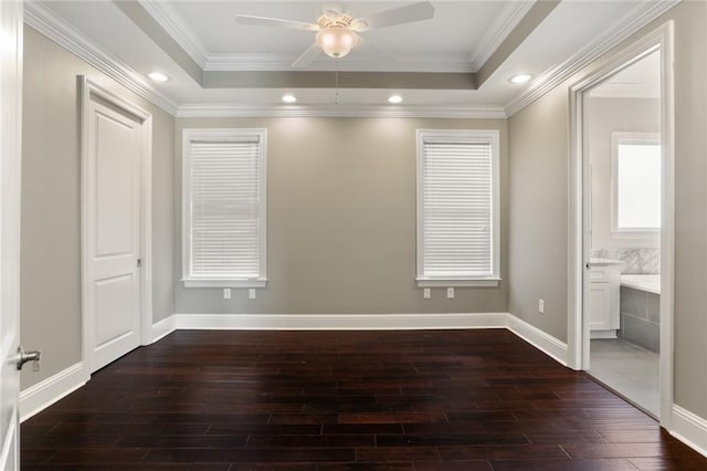 empty room featuring crown molding, dark hardwood / wood-style flooring, and ceiling fan