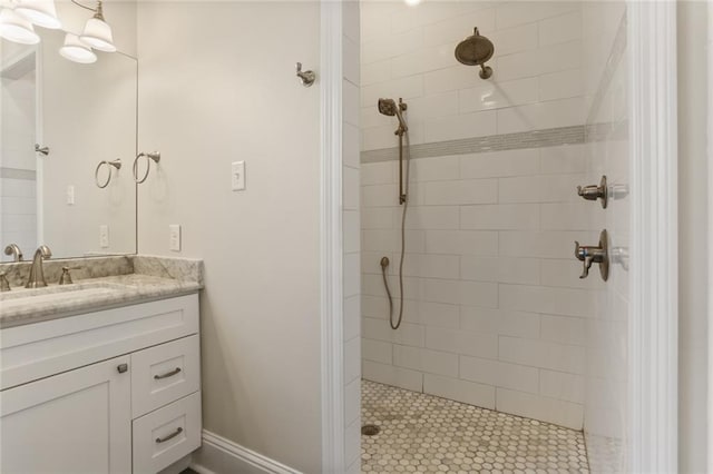 bathroom featuring vanity and a tile shower