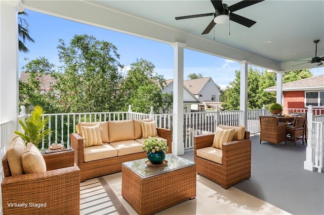 sunroom featuring ceiling fan