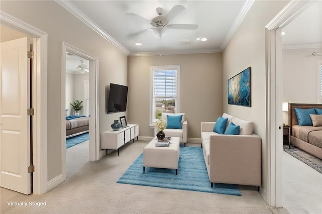 living room featuring light carpet, ceiling fan, and ornamental molding