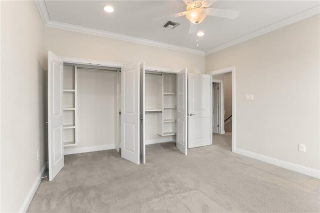 unfurnished bedroom featuring light carpet, ceiling fan, and crown molding