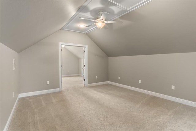 additional living space featuring light carpet, lofted ceiling, and ceiling fan