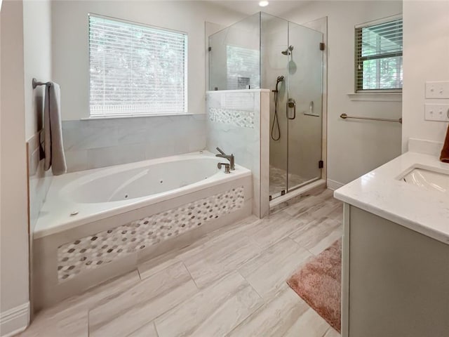 bathroom with plus walk in shower and vanity