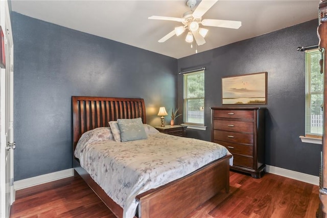 bedroom featuring ceiling fan and dark hardwood / wood-style flooring