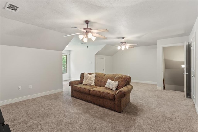 living room with ceiling fan, light colored carpet, and lofted ceiling