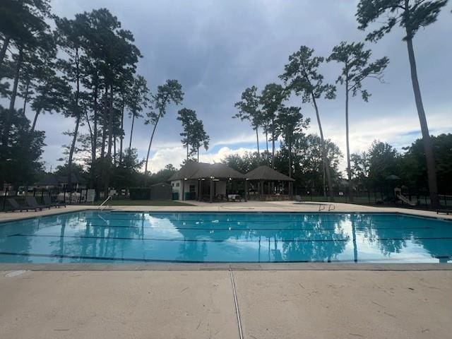 view of swimming pool with a gazebo