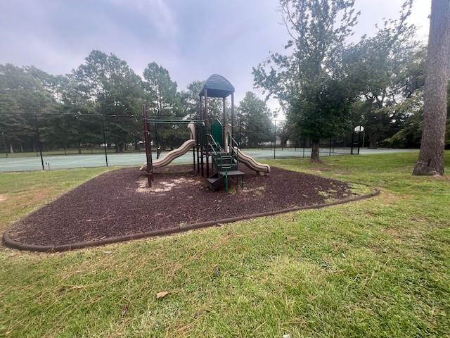 view of playground with a yard