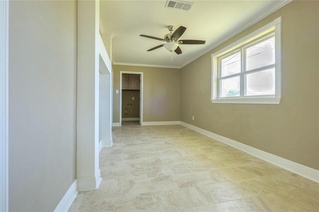 empty room with ornamental molding and ceiling fan