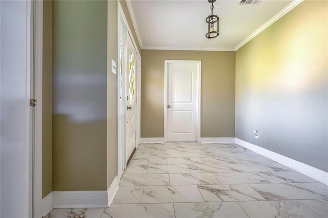 foyer featuring ornamental molding