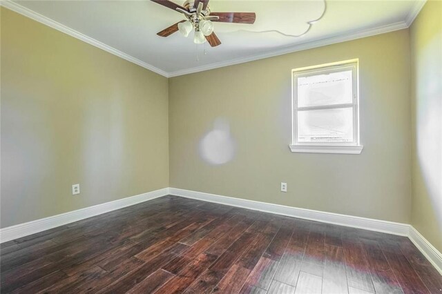 empty room featuring crown molding, dark hardwood / wood-style floors, and ceiling fan