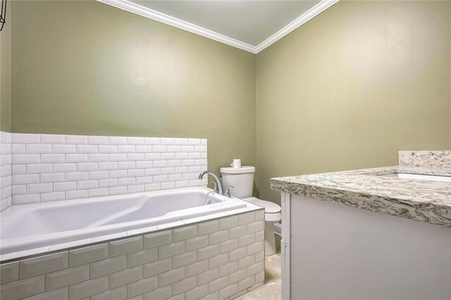 bathroom with toilet, a relaxing tiled tub, vanity, and crown molding